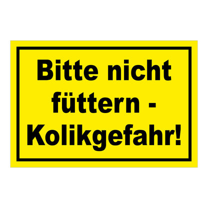 Schild Bitte nicht füttern Kolikgefahr in Gelb mit schwarzem Text und schwarzem Rand