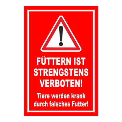 Schild „FÜTTERN IST STRENGSTENS VERBOTEN! Tiere werden krank durch falsches Futter!“ in Rot Weiß