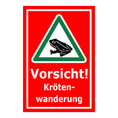 Schild Vorsicht Krötenwanderung ‚Vorsicht! Kröten-wanderung‘ mit rotem Hintergrund