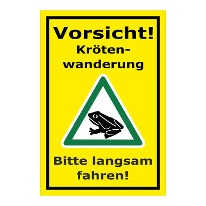 Schild Vorsicht Krötenwanderung Bitte langsam fahren in gelbem Hintergrund