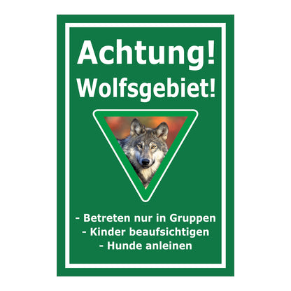 Schild Achtung Wolfsgebiet mit Verhaltenshinweisen „Achtung! Wolfsgebiet!“ in Grün mit weißem Rand